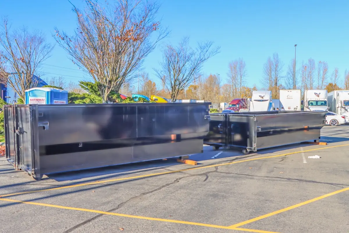 Professional dumpster rental service with roll-off container on residential driveway in Upper Uwchlan